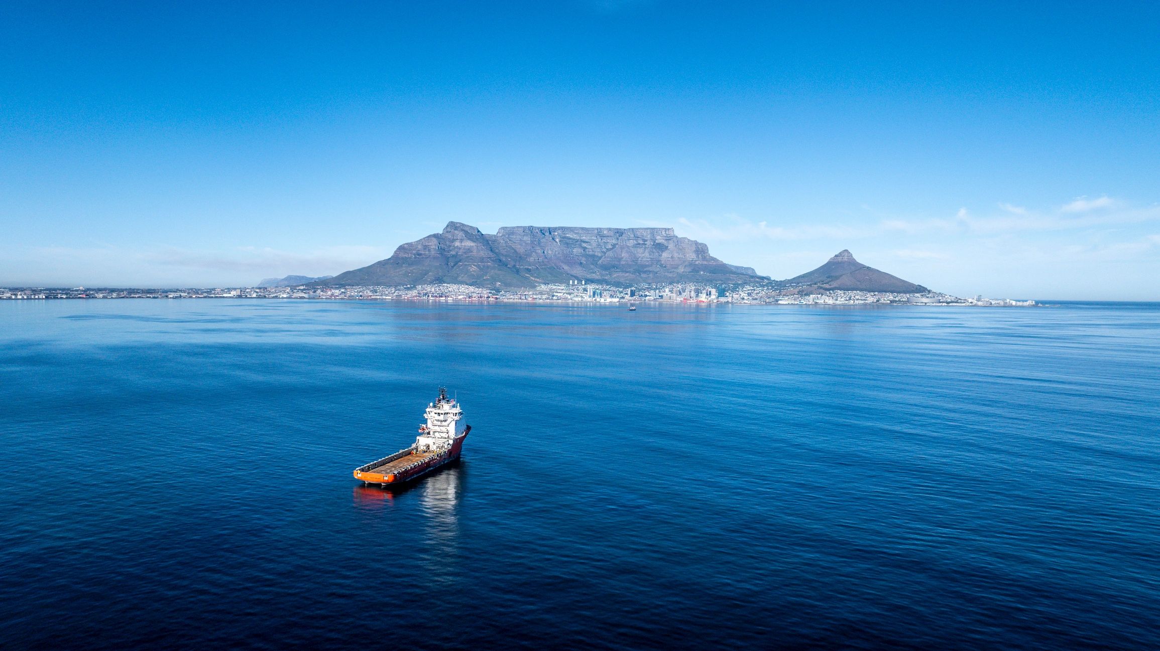 Tug and supply vessel near a harbor