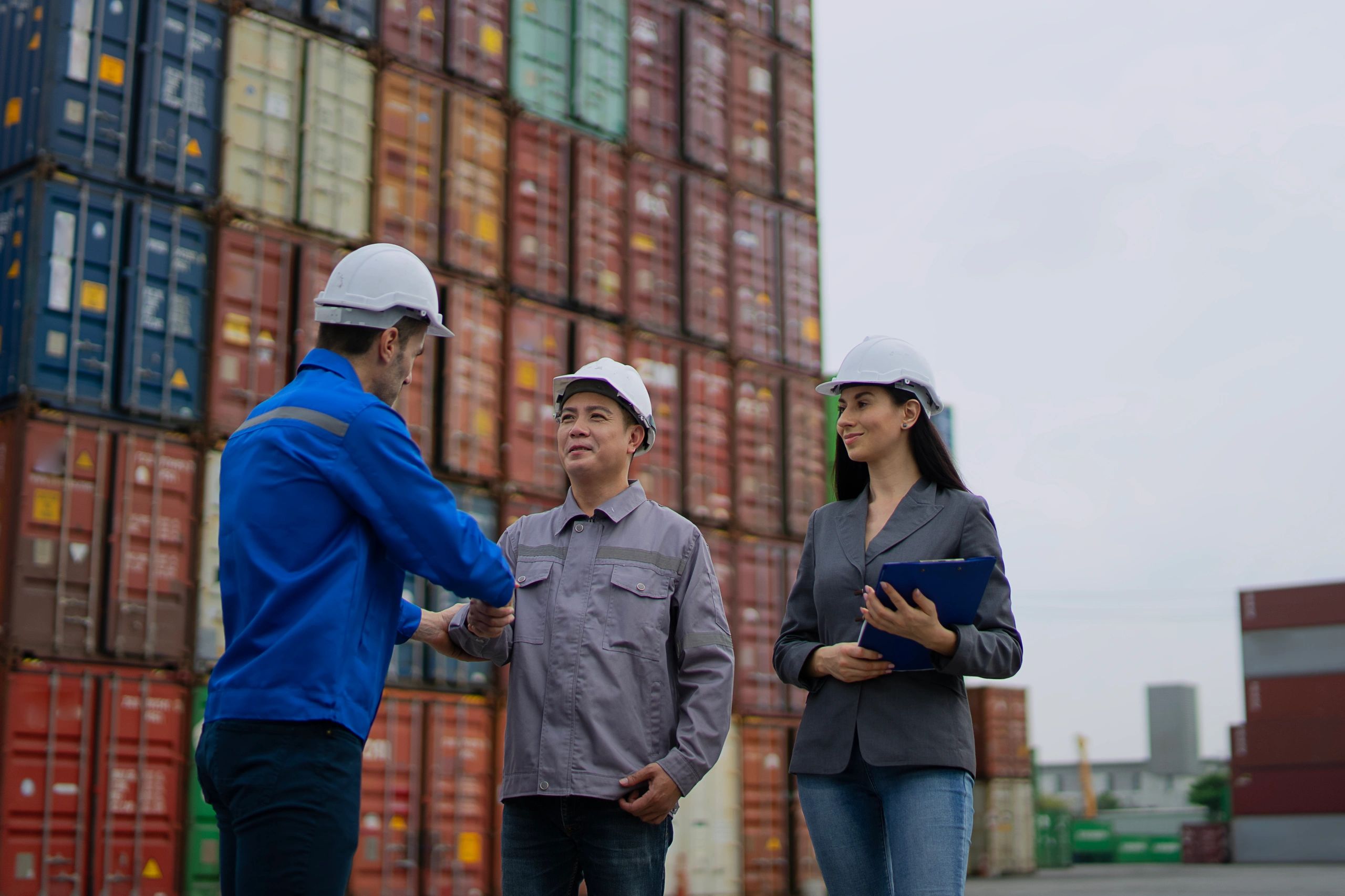 Port logistics workers coordinating transport operations at a container terminal